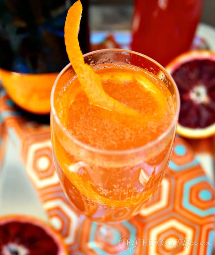 Blood Orange French 75 in a fluted glass