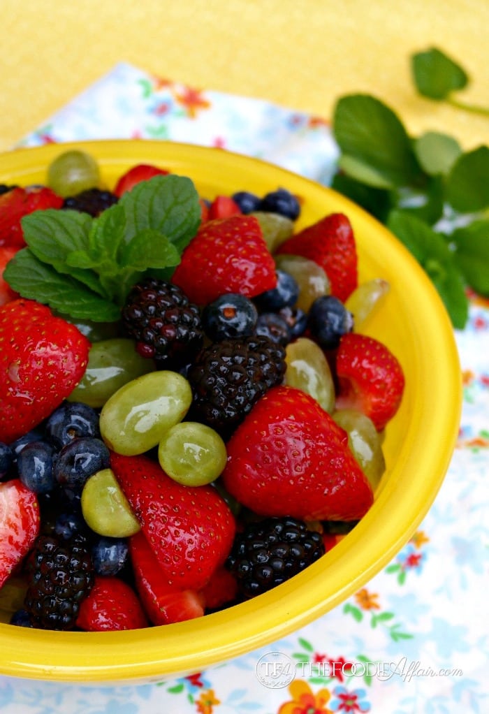 fruit salad in a yellow serving bowl