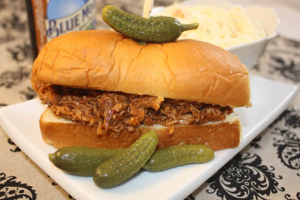 Shredded BBQ Chicken Crockpot Recipe made with your favorite pre-made sauce. #slowcooker #crockpot #chicken | www.thefoodieaffair.com