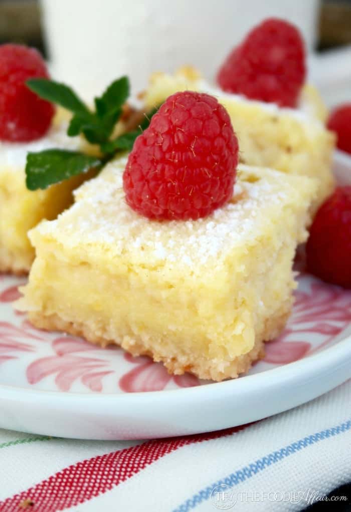 Lemon Bars gluten free recipe with a fresh raspberry on top