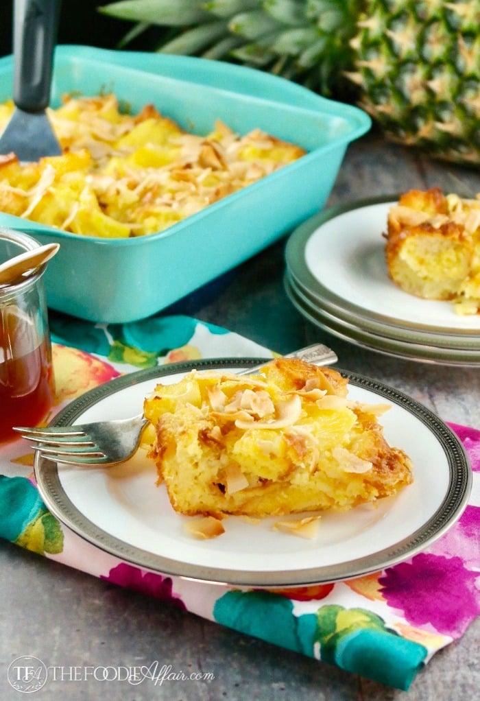 Pineapple bread pudding on a silver lined white plate